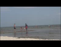 Man red shorts breakdance until another man joins him