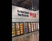 Kid reads huge sign on grocery store