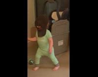 Baby walks with hat on face falls