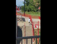 White shirt guy dances music video stairs 