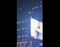 Knicks fan sits on top of billboard