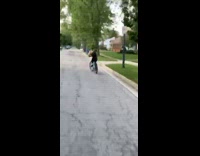 Girl falls off bike face plant