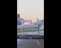 Person in office watch movie from cruise ship