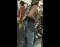 Guy with trash can bag cape plays Bingo was his Name-O on the saxophone on subway