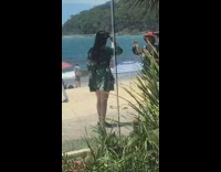 Ladies in matching floral dress take photos