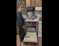 Husband checks on broken dishwasher 