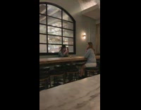 Girl takes photo inside restaurant 