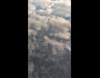 Sky full of clouds reflects on water