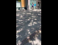 Man with yellow headband dance street sidewalk