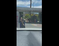 Woman black tank top selfie in front of filmers car