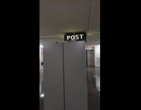 Guy inside mail room with flashing lights