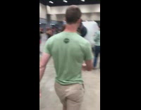 Guy interrupts photos with balloon bottle 