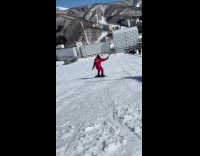 Woman snowboarding falls on her face 