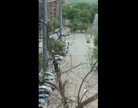 White Car Spins Near Parking Lot for Video 