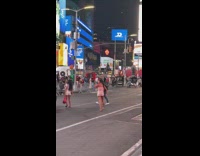 Two women walk pose on road NYC