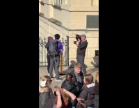 Two travelers with camera crew at Prague