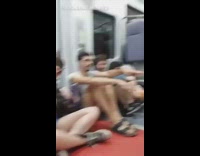 Kid sitting in handicap seat headbangs to country song on the train