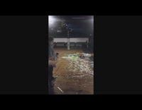 girl sliding into a pile of trash