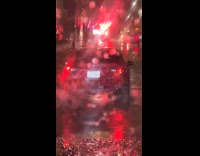 Car drives with broken hanging exhaust pipe