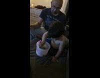 Baby scoops ice cream with fork