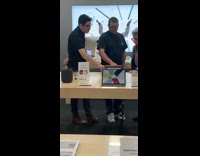 man white shirt sunglasses apple store dance