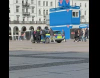 Police woman car door middle street work