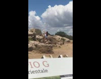 Woman white top hands air rocks pictorial