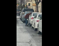 Person pumping tire with basketball pump