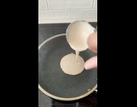 Pancake mixture cooked and sizzles in pan