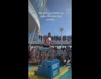 Guy takes off shirt and enters belly flop contest