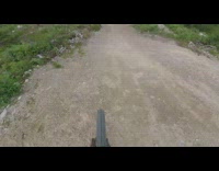 Guy bikes over hills and falls then yells