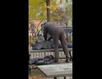 Guy gives back massage to friend table 