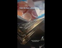 Woman sneaks in liquor shots under fake cake 