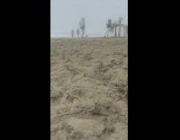 Girl grey hoodie dance beach sand cloudy