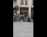 Man overexaggerates angle to take picture of woman