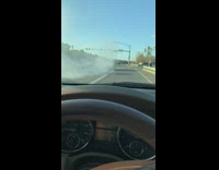 Three cars street drag race black car spin out