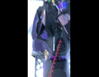 Guy does wheelie on purple snowmobile 