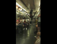 Collab Subway Creatures - Guy in black vinyl outfit vogues on subway train and dances with girl