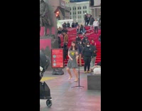 Girl films herself dancing alone times square 