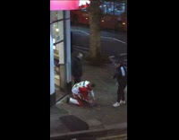 Guy wearing KFC sweater runs with bucket