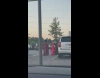 Group of women in their dress poses inside the pushcart