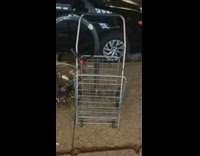 Utility shopping cart locked to bike rack 