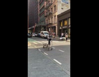 Guy rides metal platform cart like scooter
