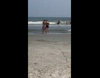 Guy get facial reaction directed shorts beach
