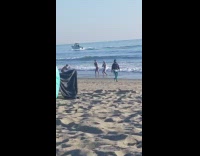 Two guys brief dance beach green inflatable