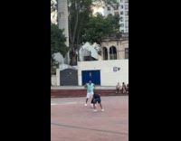 Man light blue shirt dance at park