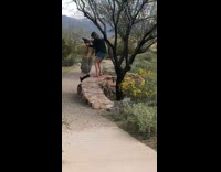 Lady holds ankles handstand push ups 