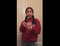 Girl red sweater restroom hair cut scissor 