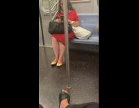 Woman in red dress wears yellow flats with pinky toe almost poking out