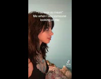 Woman tries to give fake smile 